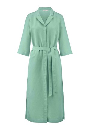 Light green linen wrap dress with a collar, three-quarter sleeves, and a matching belt, featuring side slits for ease of movement.