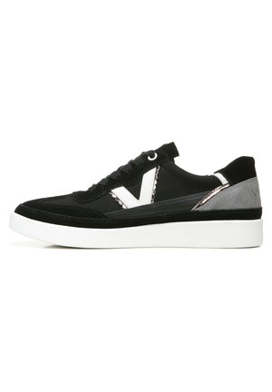 Black suede sneakers with a white rubber sole. Features a black and white design, textured accents, and a subtle grey panel on the heel.