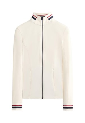 White zip-up jacket with a high collar, featuring navy and red striped accents on the collar and cuffs. Two pockets on the front.