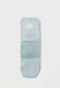 Αθλητική κάλτσα ανοιχτού πράσινου με ραβδωτή υφή, που διαθέτει λευκά λογότυπα και μαξιλαράκια για υποστήριξη. Σχέδιο ύψους αστραγάλου.