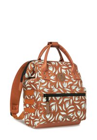 Backpack with a floral pattern in orange and cream, made of fabric with leather accents. Features short handles and a front zipper pocket.