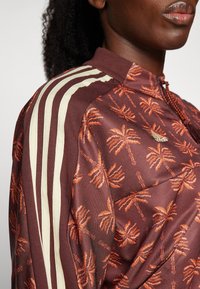 adidas Sportswear ADIDAS FARM RIO TIRO TRACK - Mikina na zip - hazy copper/fox red/mystery brown