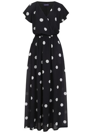Robe maxi en chiffon noir à pois blancs, dotée d'un design enveloppant, de manches courtes et flottantes, et d'une taille élastique pour un ajustement confortable.