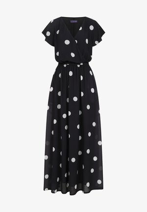 Robe maxi en chiffon noir à pois blancs, dotée d'un design enveloppant, de manches courtes et flottantes, et d'une taille élastique pour un ajustement confortable.