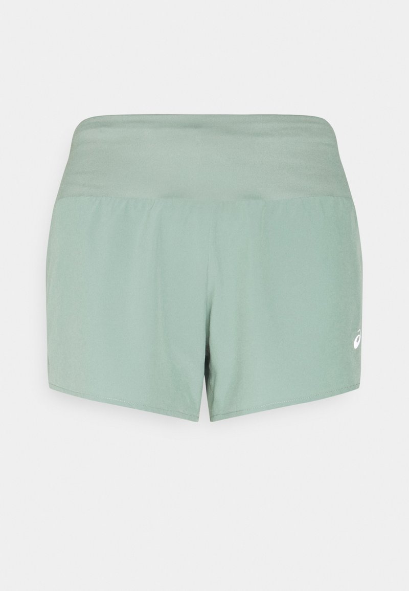 Light green athletic shorts with a smooth texture, elastic waistband, and logo accent on the side. Simple design, thigh-length cut.