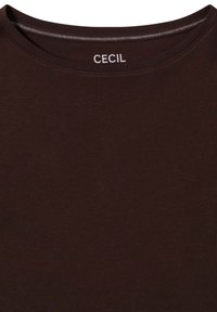 Brown short-sleeve shirt made from soft cotton, featuring a crew neckline with a contrasting stitched edge and "CECIL" label on the collar.