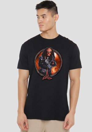 Black t-shirt featuring a detailed graphic of a character holding a weapon, set in a circular design with a cosmic background.