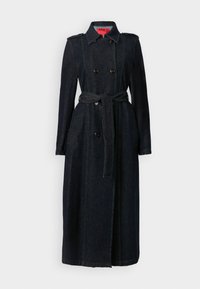 Mørk denim trench coat med dobbeltradet knaplukning, bælte i taljen, grøn kontrasterende syning og skulderepauleter. Lange ærmer med knapmanchetter.