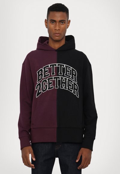 Color-blocked hoodie in purple and black, featuring a front graphic "BETTER 2GETHER" in white. Soft fabric with a relaxed fit and hood.