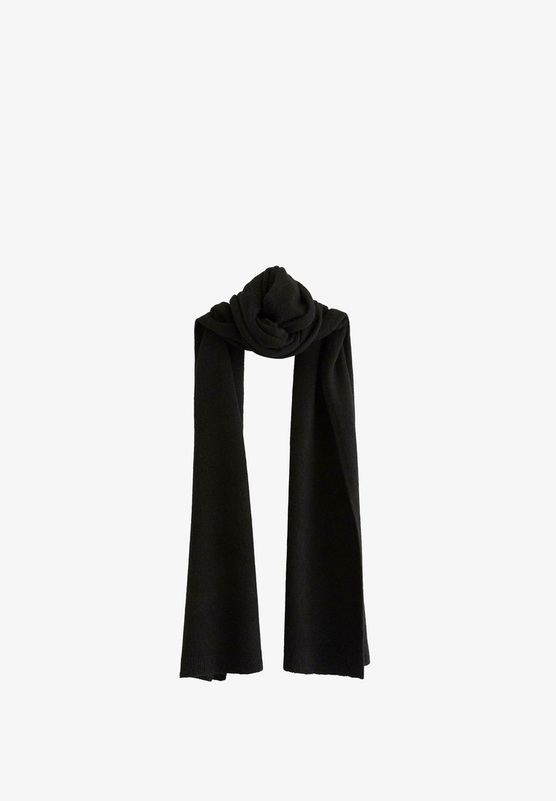 Écharpe noire en tricot, présentant une texture lisse, un design long avec des extrémités tombantes, et un détail de nœud torsadé en haut pour le maintien.