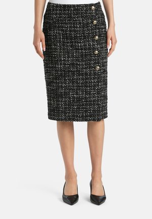Zwart-witte tweed kokerrok met een gestructureerde afwerking, voorzien van vijf goudkleurige knopen aan de linkerkant, knielange snit.