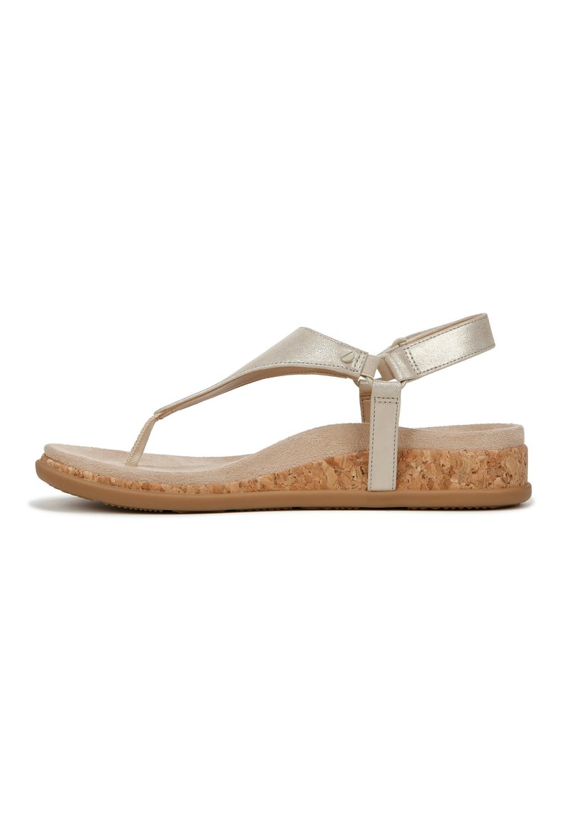 Metallic gold thong sandal with cork wedge sole, soft beige footbed, adjustable back strap, and textured upper for improved grip.