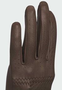Brown leather glove with perforated pattern on fingers and a textured palm. Features contrasting stitching along the cuff for added detail.