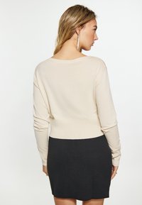 faina Cardigan - elfenbein