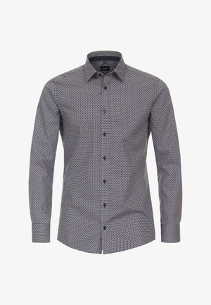 Chemise à manches longues bleu marine avec un motif géométrique, en coton. Elle possède un col pointu et des boutons bleus le long du devant.