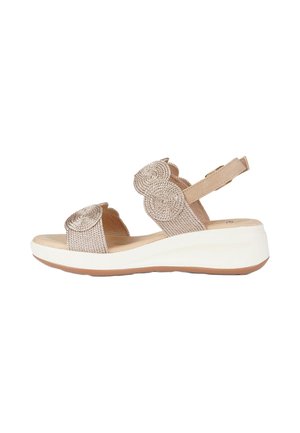 Sandalo beige da donna con punta aperta, motivi decorativi circolari intrecciati, cinturino regolabile alla caviglia, soletta imbottita e suola platform bianca.