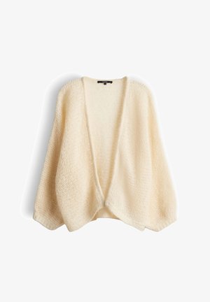Cardigan en tricot épais couleur crème avec devant ouvert, manches longues ballon et tissu doux et texturé.