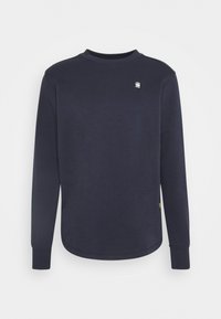 Mörkblå långärmad sweatshirt i bomullsblandning med rund halsringning, ribbade muddar och en liten logga på bröstet.