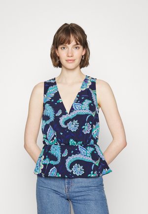 Top sem mangas azul-marinho com decote em V, apresentando um padrão paisley em azul-turquesa e verde, cintura ajustada e bainha peplum.