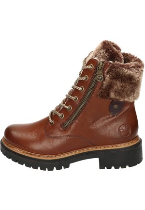 Bottines en cuir marron avec un revers en fausse fourrure, à lacets à l'avant et fermeture éclair sur le côté. Semelle robuste avec un motif de crans pour une meilleure traction.