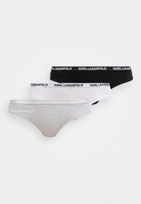 Tři páry dámských kalhotek v šedé, bílé a černé barvě. Elastické pasy s nápisem "KARL LAGERFELD". Jemný bavlněný materiál.