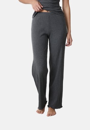 Pantalons de détente gris côtelés avec une coupe droite, taille élastique et détails à ourlet festonné, confectionnés dans un tissu doux.