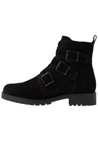 Bottines en suede noir à chevilles avec trois boucles réglables, bout rond et semelle en caoutchouc texturée, dotées d'un petit talon extrême pour plus de stabilité.