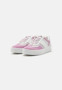Pink and white sneakers with suede and leather materials. Features include flat laces, a padded tongue, and textured rubber soles.