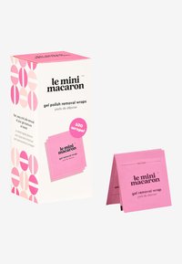Boîte rose de wraps pour le retrait de vernis gel avec des motifs circulaires. Contient 100 wraps individuels, chacun dans une pochette rose avec un onglet de déchirure.