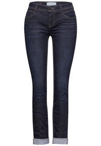 Granatowe dżinsy o slim fit, z pięcioma kieszeniami, szlufkami na pasek i podwiniętymi mankietami. Szwy w kontrastowym kolorze.