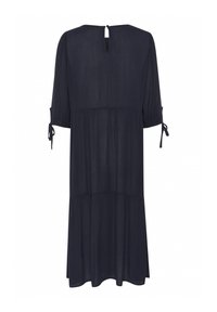 Vestido azul marino de corte holgado, con mangas abullonadas de tres cuartos, escote con detalle de ojales y lazos en las mangas. Tela suave y ligera.
