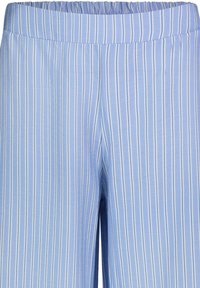 Light blue striped pants with an elastic waistband. Stripes are alternating between light blue and white, featuring a soft textured fabric.
