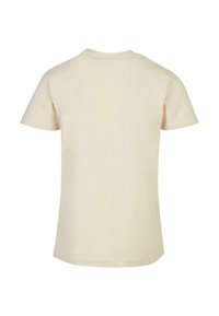 Kremowa t-shirt z krótkim rękawem, okrągłym dekoltem, wykonana z miękkiej bawełny, o gładkiej teksturze i prostym wykończeniu na dole.