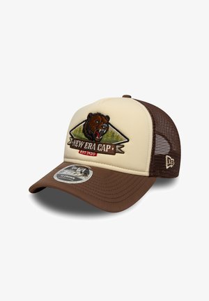 Brown and cream trucker cap featuring a bear graphic, embroidered details, curved brim, and mesh back for ventilation.