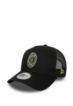 Black cap with mesh sides, adjustable strap, featuring an embroidered round logo in cream, and a curved brim. New Era branding visible.