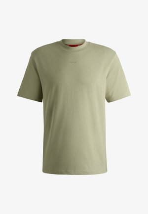 Green cotton t-shirt with a classic crew neck, short sleeves, and no visible patterns. Features 'HUGO' logo embroidered on the front.