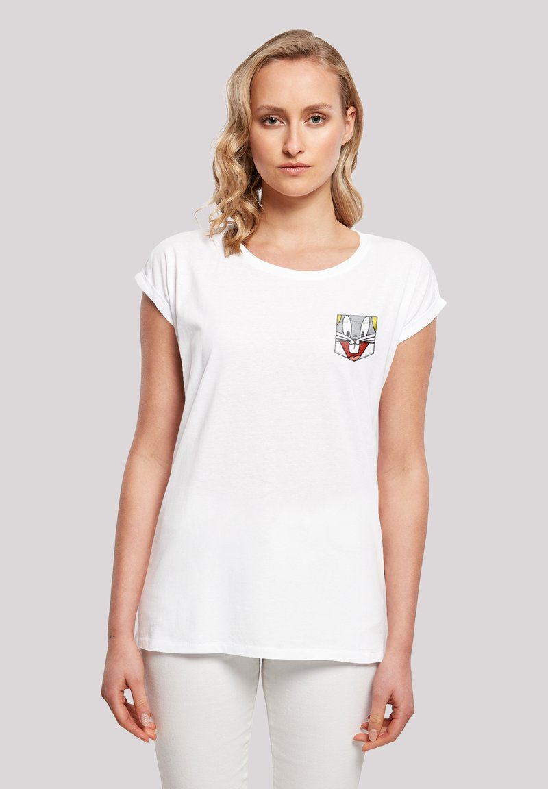White cotton t-shirt with short rolled sleeves and a round neckline. Features a Bugs Bunny graphic pocket detail on the left chest.