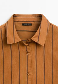 Brown button-up shirt with black vertical stripes and a classic collar labeled Massimo Dutti.
