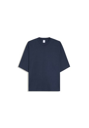 T-shirt oversize bleu marine à manches courtes avec col rond, présenté sur fond blanc.