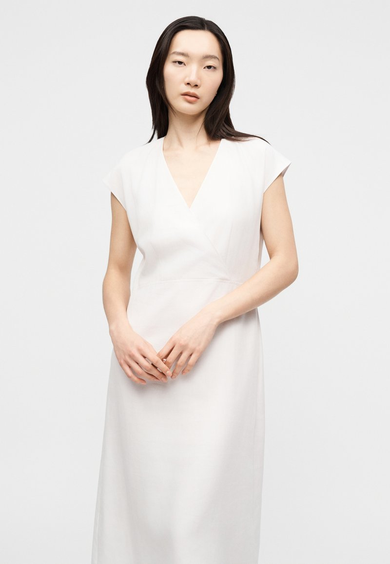 white eyelet dress with sleeves Merlette Paradis Eyelet Dress White / Dress / X-Small main image 1