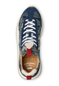 Sneaker featuring a navy fabric upper with floral pattern, white laces, cork insole, red pull tab, and rubber outsole.