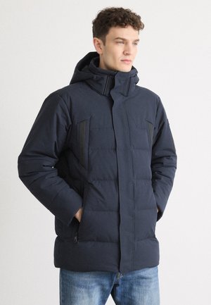 Marineblauer Puffer-Jacke mit Kapuze, kontrastierende schwarze Streifen, mit Reißverschlüssen versehene Taschen und gesteppte Textur zur Isolierung.