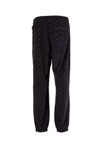Black velour jogger pants with elastic waistband, elasticized cuffs, and a single back pocket, shown from the rear.
