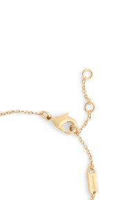 Gold-tone bracelet featuring a delicate chain design, lobster clasp closure, and a small tag with the brand name.