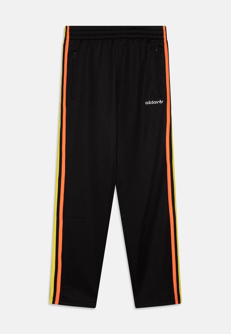 Black athletic pants featuring orange and yellow side stripes, a drawstring waistband, and zippered pockets. Adidas logo on hip.