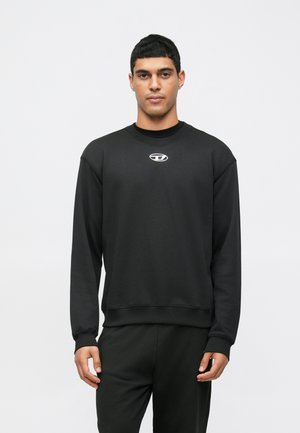 Black sweatshirt made of soft fabric, featuring a crew neckline and long sleeves. A small logo is centered on the chest.