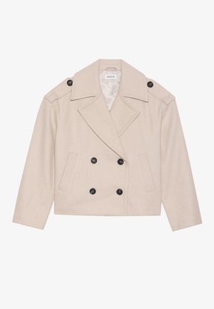 Beige croppet dobbeltspent ullfrakk med vide krager, to frontlommer og svarte knapper foran og på skulderklaffene.