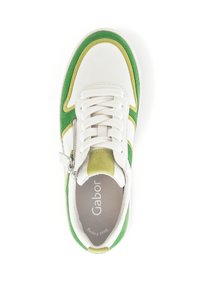 White leather sneaker with green and yellow suede accents, round toe, lace-up front, and side zipper feature, designed for comfort.