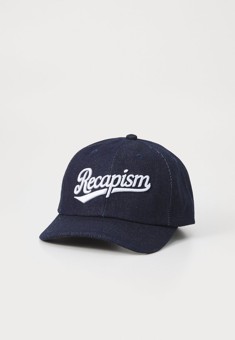 Navy blue baseball cap made of textured fabric featuring white embroidered "Recapism" logo on the front and a curved peak.