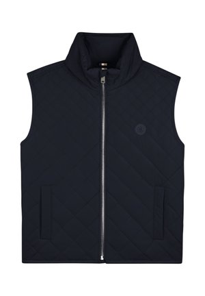 Bezrękawnik pikowany w ciemnym granatowym kolorze z przednim zamkiem błyskawicznym, stójką, bocznymi kieszeniami oraz małym okrągłym logo na piersi.